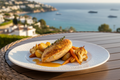 Pollo tierno marinado con limón, ajo, cebolla y tomillo, acompañado de patatas, zanahorias y coliflor asadas. Un plato mediterráneo, fresco y reconfortante.